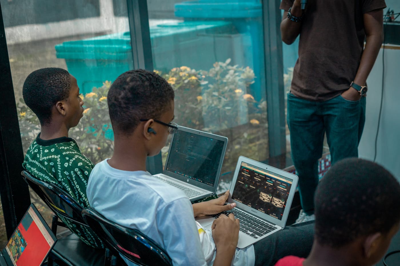 Two students working together on a laptop