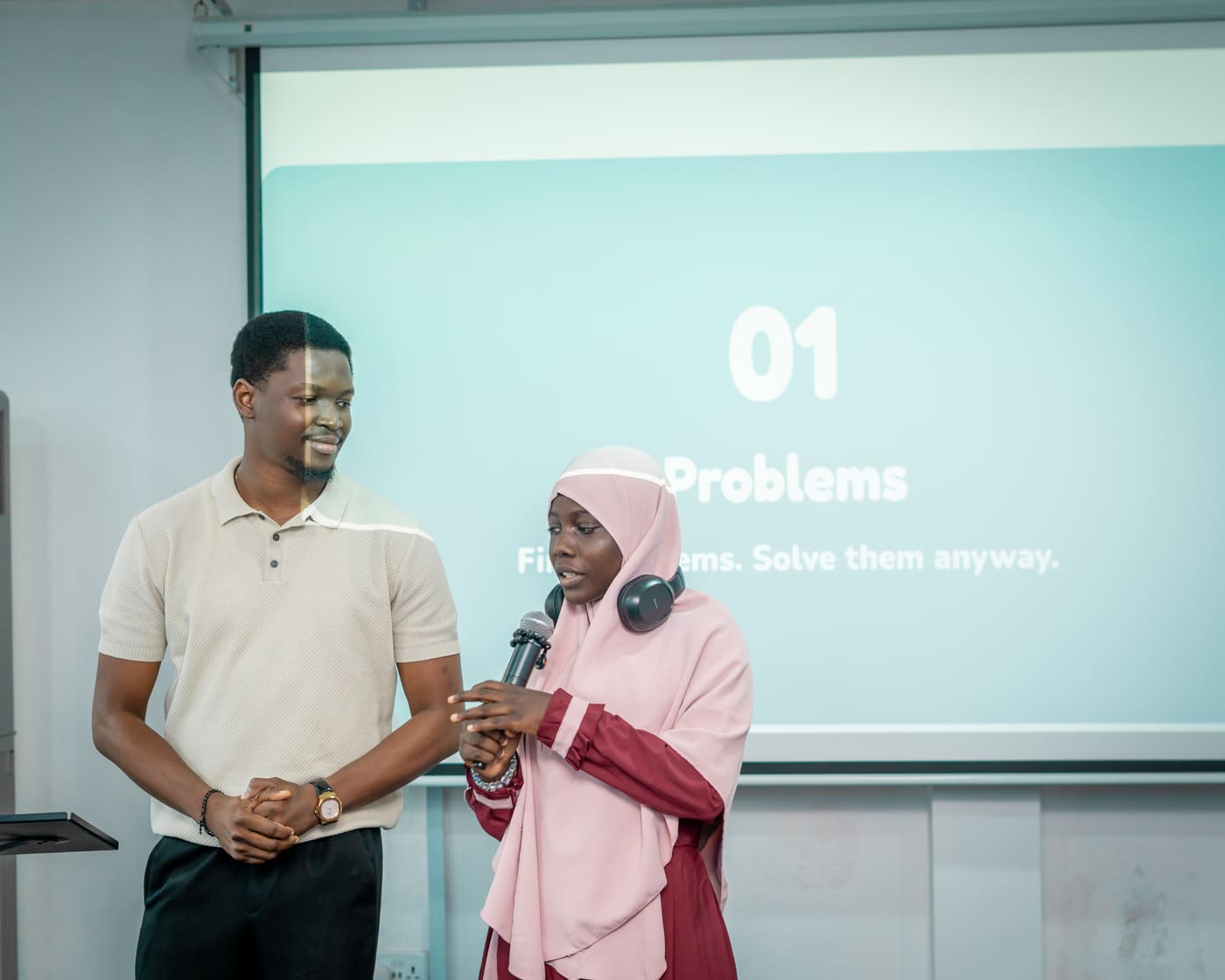 A student presenting her project on stage