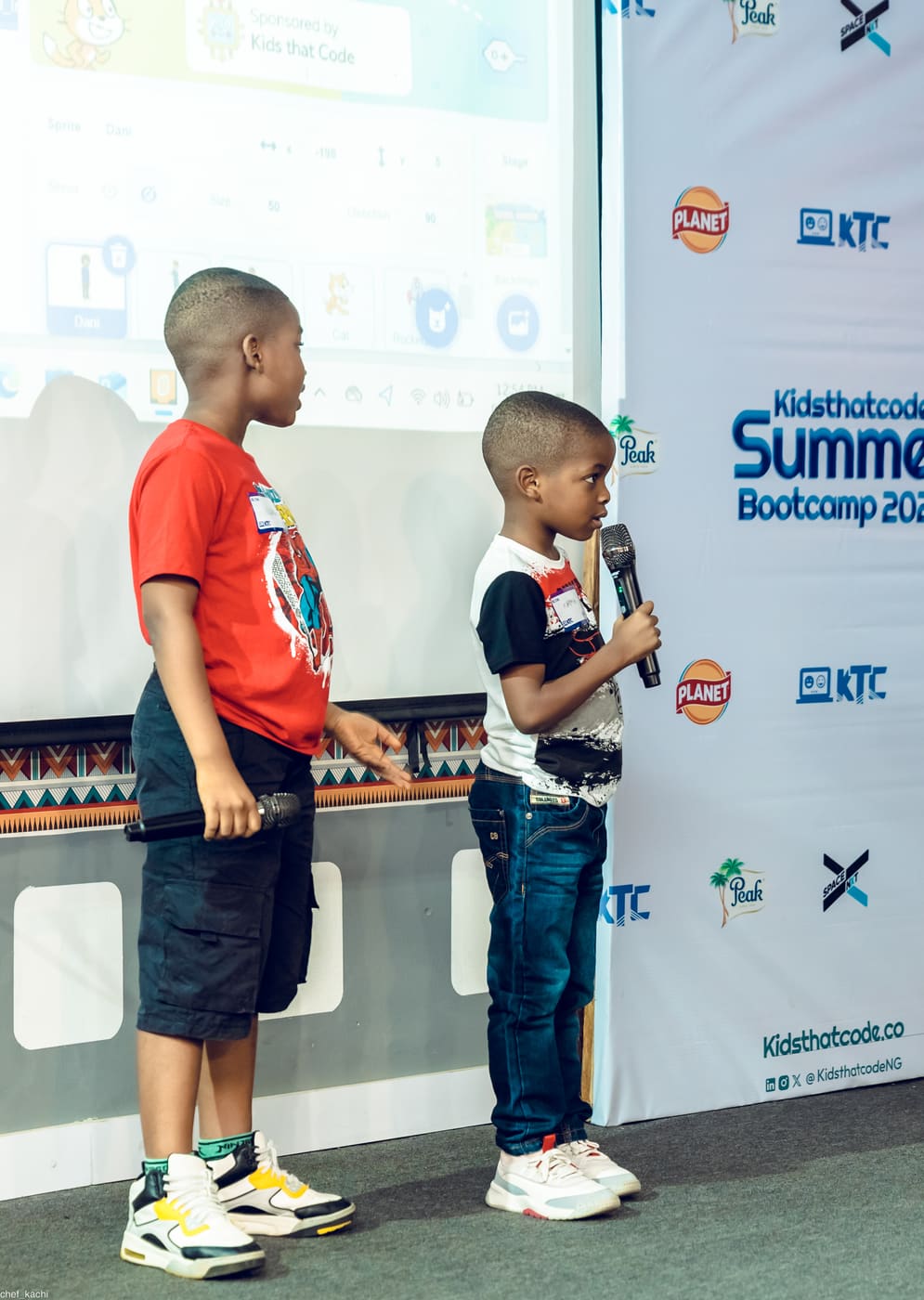 A student on stage at the KTC summer bootcamp